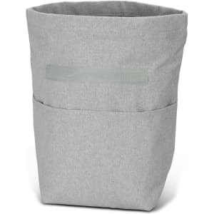 A grey cooler bag with a soft texture and a front pocket, featuring a subtle logo.