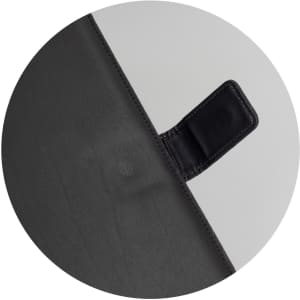 A black portfolio with a smooth textured surface and a small, attached flap. It features a logo.