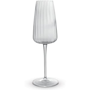 A clear glass flute with a ribbed design and a slender stem, featuring a simple, elegant silhouette.