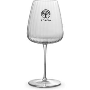 A clear, ribbed wine glass with a tall stem and a logo at the top. Ideal for serving Bordeaux wine.