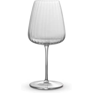 A wine glass with a ribbed design, made of clear glass, featuring a tall stem and a wide bowl.