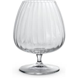 A clear, ribbed cognac glass with a round base, showcasing an elegant design.