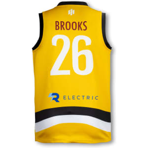 A yellow men's AFL top featuring a black and white stripe, with a name and number on the reverse, and a logo.