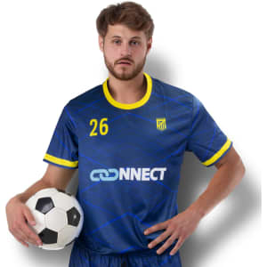 A men's soccer top in blue with yellow accents, featuring a logo and number 26, held by a man with a soccer ball.