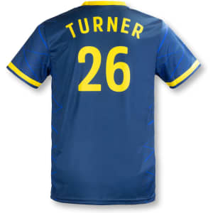 A blue men's soccer jersey featuring yellow accents, a name, and a number on the back.