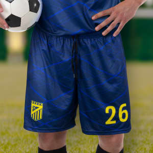 Custom men's soccer shorts in navy blue with a logo and yellow detailing, featuring number 26.