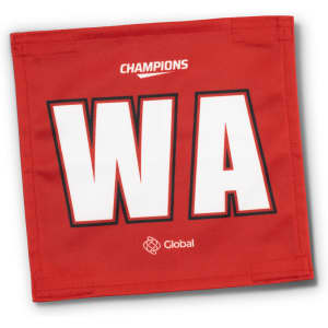 A red netball bib featuring large white letters "WA" and a logo at the bottom.