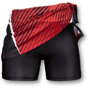 A red and black custom women's netball skirt with a striped design, featuring a fitted black undershort and a logo.