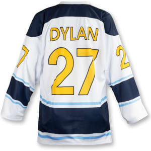 A custom hockey jersey in white, navy, and blue with a yellow name and number design. It features a logo.