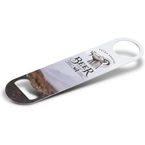 A drink bottle opener featuring a metal design with a printed landscape and a logo. Predominantly silver and multicoloured.