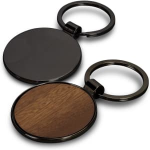 A round key ring featuring a black metal finish and a wooden side, with a logo present on the metal part.