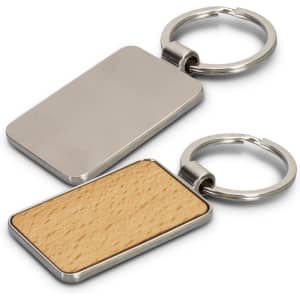 A rectangular key ring featuring a polished metal surface and a wooden back, attached to a metal keychain.