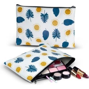 A medium cosmetic bag featuring a vibrant design with blue leaves and yellow suns, filled with makeup items.