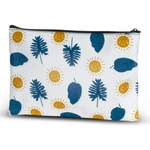 A medium cosmetic bag featuring a pattern of blue leaves and yellow suns on a white background, with a black zipper.