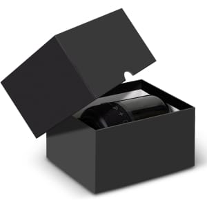 A black box with an open lid containing a black Bluetooth speaker, featuring control buttons on the front.