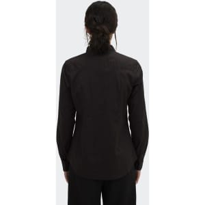 A women's black button-up poplin shirt featuring long sleeves and a fitted design, with a simple logo on the back.