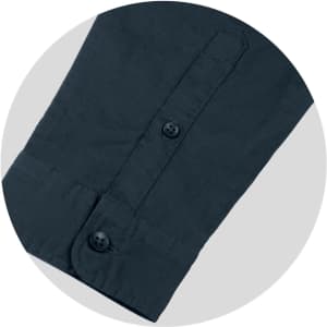 A dark grey button-up shirt sleeve featuring a double-button cuff and neat stitching. It has a logo on the fabric.