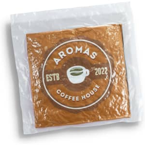 A square, brown cushion packaged in a clear plastic wrap, featuring a logo and design elements.