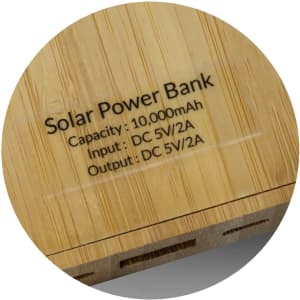 A bamboo solar power bank with a capacity of 10,000mAh and input/output specifications presented.