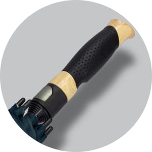 A dark green sports umbrella featuring a textured black handle with a wooden finish and a metal tip.