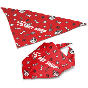 A large red pet bandana featuring playful patterns of bones, paw prints, and toys, with a logo.