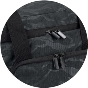 A dark green cooler bag featuring a camouflage pattern, with dual zippers and sturdy black straps.
