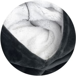 A soft, grey blanket hoodie with a plush white interior, featuring a seamless design and a logo.