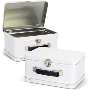 A white tin lunch box with a silver interior and a black handle, featuring a metal clasp closure.