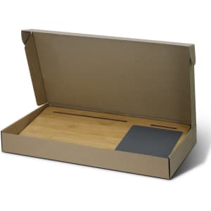 A bamboo lap desk in a cardboard box, featuring a sleek grey section and a smooth bamboo surface.