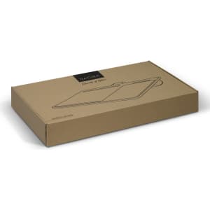 A brown cardboard box containing the NATURA Bamboo Lap Desk, featuring a logo on the surface.