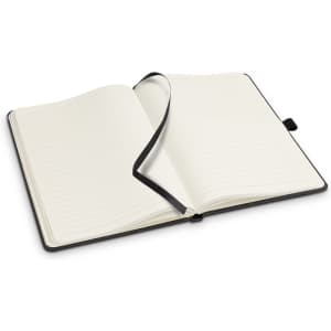 An open Petros Stone Paper Notebook with lined pages and a black cover, featuring a ribbon bookmark.