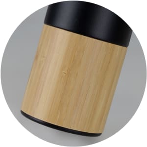 A drink bottle with a black top and a bamboo lower section, featuring a sleek, modern design. It has a logo.