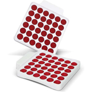 A square fidget popper board featuring a white base with red popping bubbles arranged in a grid pattern.