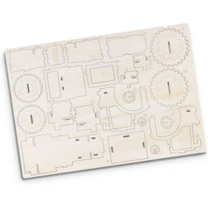A wooden model kit featuring laser-cut components including gears and various structures, ready for assembly.