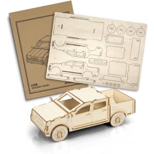 A wooden model of a ute in natural wood colour alongside instructional templates and a branded packaging.