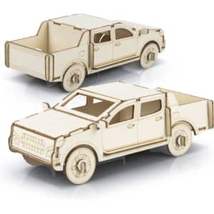 A wooden model of a UTE in a natural finish, featuring detailed cutouts and an assembled design.