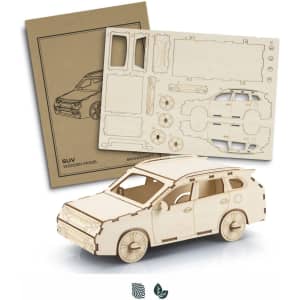 A wooden SUV model in a natural finish, accompanied by cardboard pieces for assembly. Features a logo.