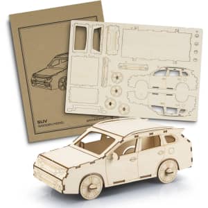 A wooden model of an SUV in a natural finish, accompanied by pre-cut pieces and assembly instructions.