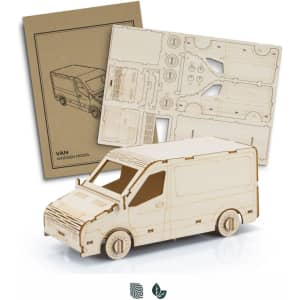 A wooden model van in natural wood colour with assembly instructions. The model features detailed cutouts and wheels.