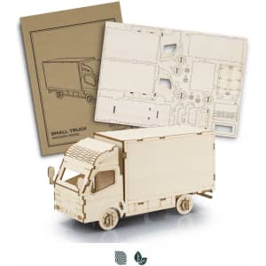 A wooden model of a small truck in natural wood colour, with assembly parts and instructions included.