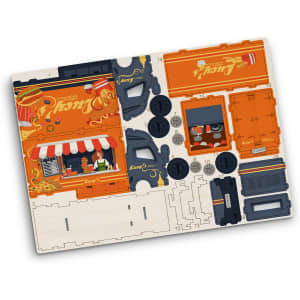 A wooden model kit of a small truck, featuring orange and black parts, including wheels and a shop scene.