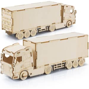Large wooden model of a truck in natural wood colour, featuring detailed cutouts and a simple design.