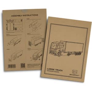 A packaged wooden model of a large truck with assembly instructions and a simple monochrome design, featuring a logo.