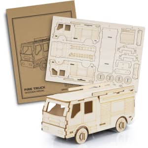 A wooden fire truck model in beige with a detailed assembly sheet. The model features wheels and cut-out sections.