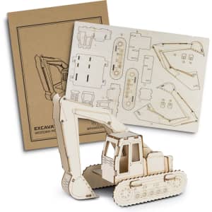 A wooden model excavator in natural wood colour, with assembly sheets and a brown packaging box.