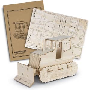 A wooden bulldozer model in natural wood tones, with packaging and assembly sheets displayed behind it.