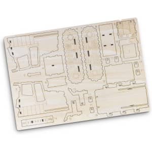 A wooden model kit of a bulldozer with laser-cut pieces on a light wooden board. Includes detailed components.