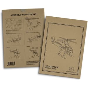 A beige instruction booklet featuring assembly steps for a wooden helicopter model, with illustrations and a logo.