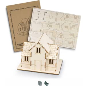 A wooden model house kit in natural colour, featuring cut-out pieces and assembly instructions. Includes a branded package.