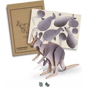 A wooden model of a kangaroo in natural and grey tones, with assembly pieces and a cardboard backing.